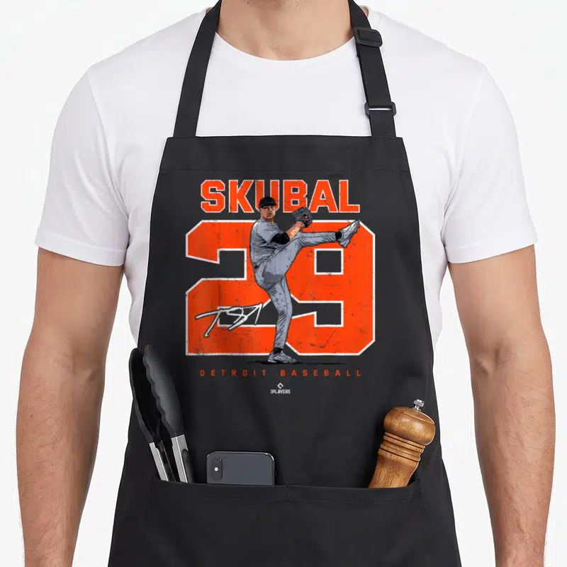 Tarik baseball apron - Realistic pitcher illustration over large orange number 29 with SKUBAL and DETROIT BASEBALL text — shown on a black cotton canvas apron against a white background