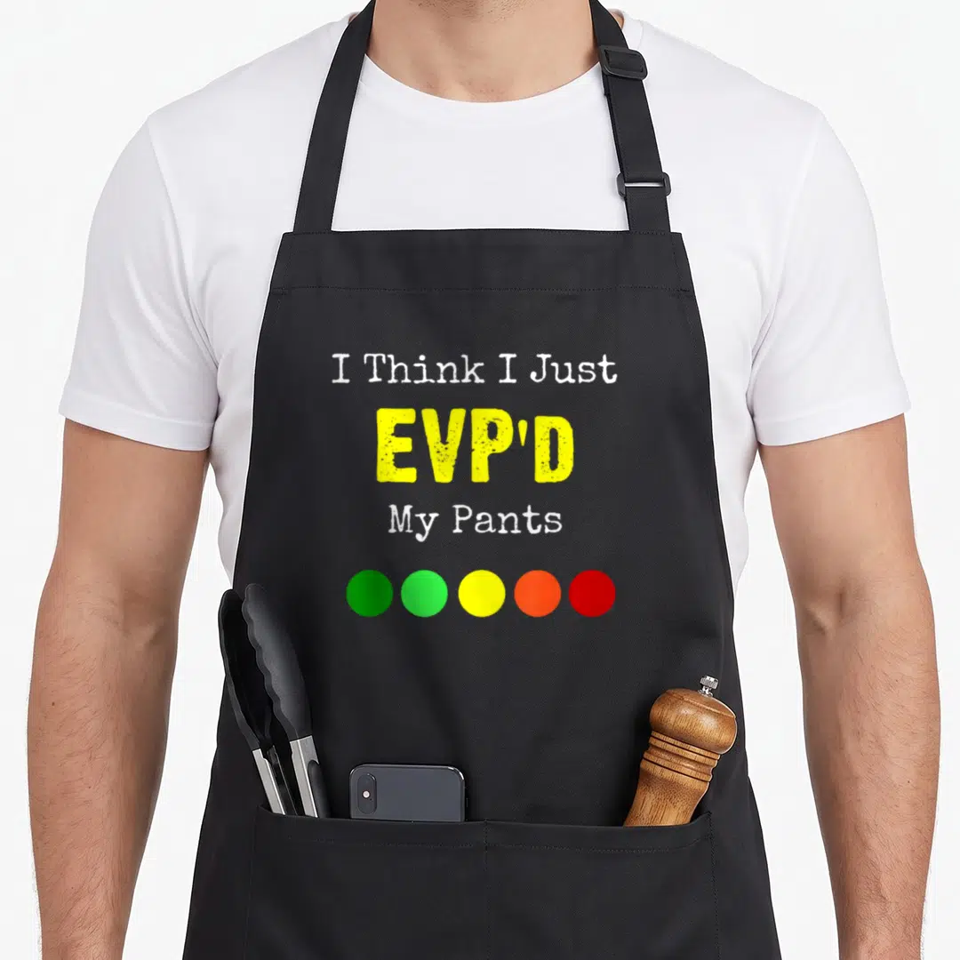 Evp ghost apron - I Think I Just EVP'D My Pants text with five green to red circles below — shown on a black cotton canvas apron against a white background