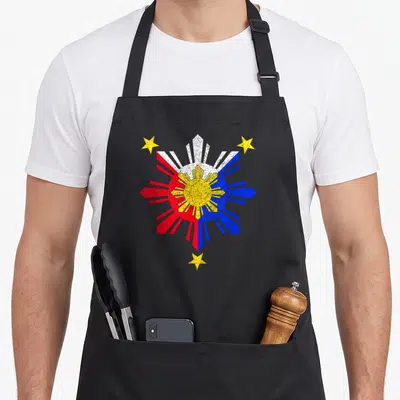 Pinoy filipino apron - Distressed yellow sun with red white blue rays and three yellow stars — shown on a black cotton canvas apron against a white background