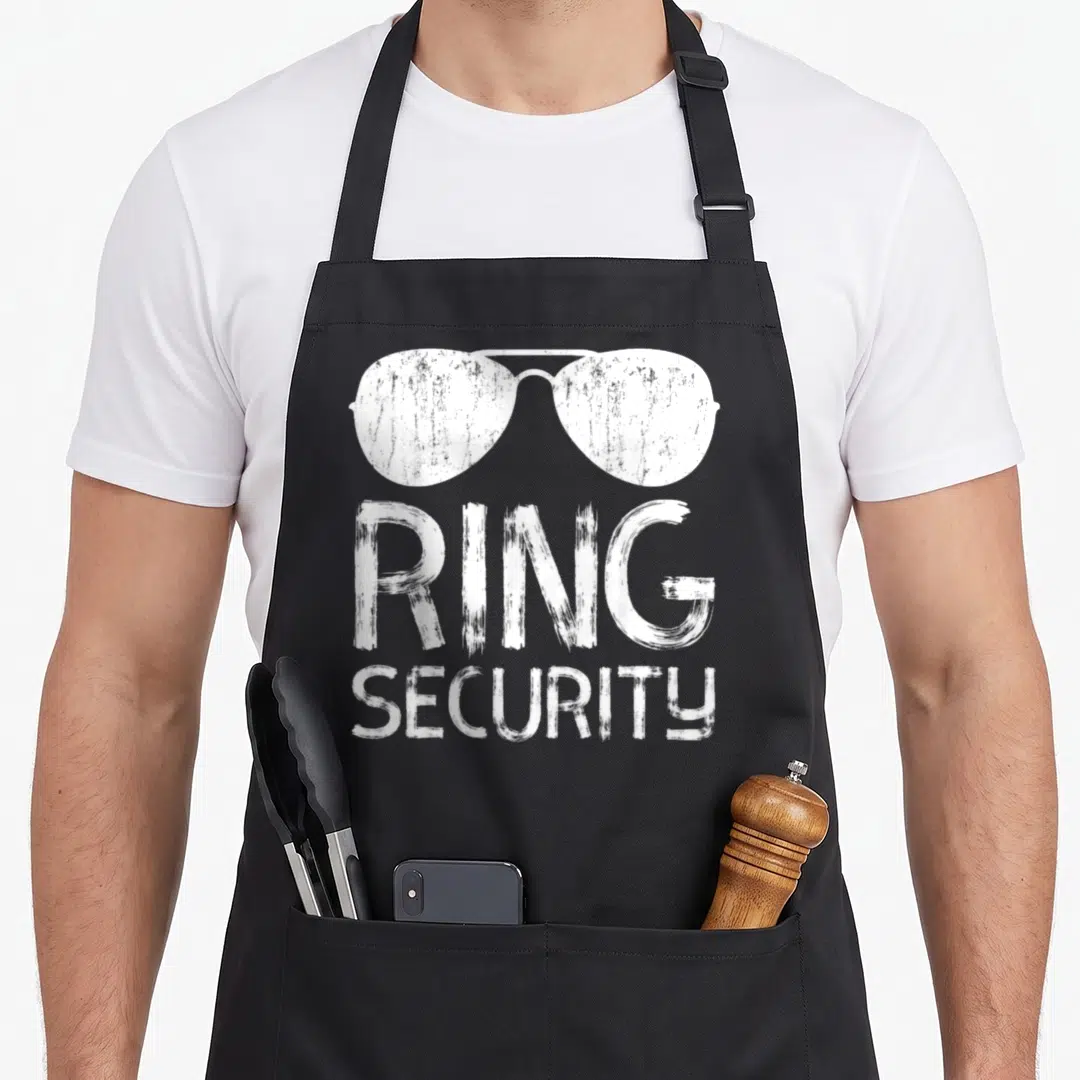 Bearer funny wedding aprons - White distressed sunglasses above RING SECURITY text — shown on a black cotton canvas apron against a white background