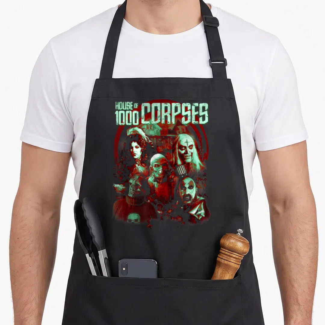 Rob character aprons - House of 1000 Corpses text and five horror characters in red and mint green distressed art — shown on a black cotton canvas apron against a white background