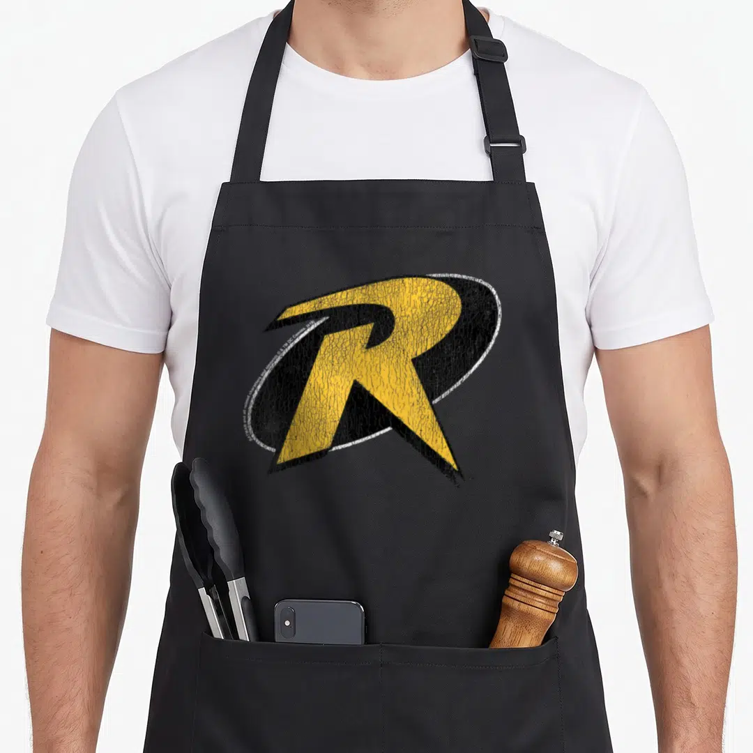 Robin animal apron - Distressed yellow R with black shadow and white outline on canvas — shown on a black cotton canvas apron against a white background