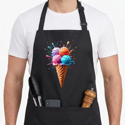 Sprinkle dripping ice cream apron - Cartoon waffle cone holding four blue pink orange and purple basketballs — shown on a black cotton canvas apron against a white background