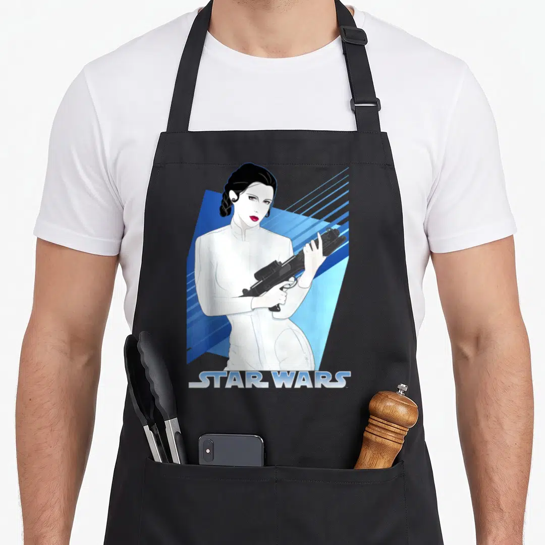 Funny 80s princess apron - Minimalist woman in white holding black blaster with blue stripes and STAR WARS text — shown on a black cotton canvas apron against a white background