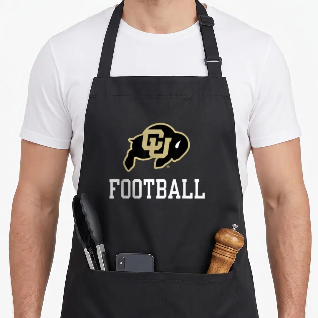 Buffaloe football apron - Black and gold buffalo logo with CU initials above white FOOTBALL text — shown on a black cotton canvas apron against a white background