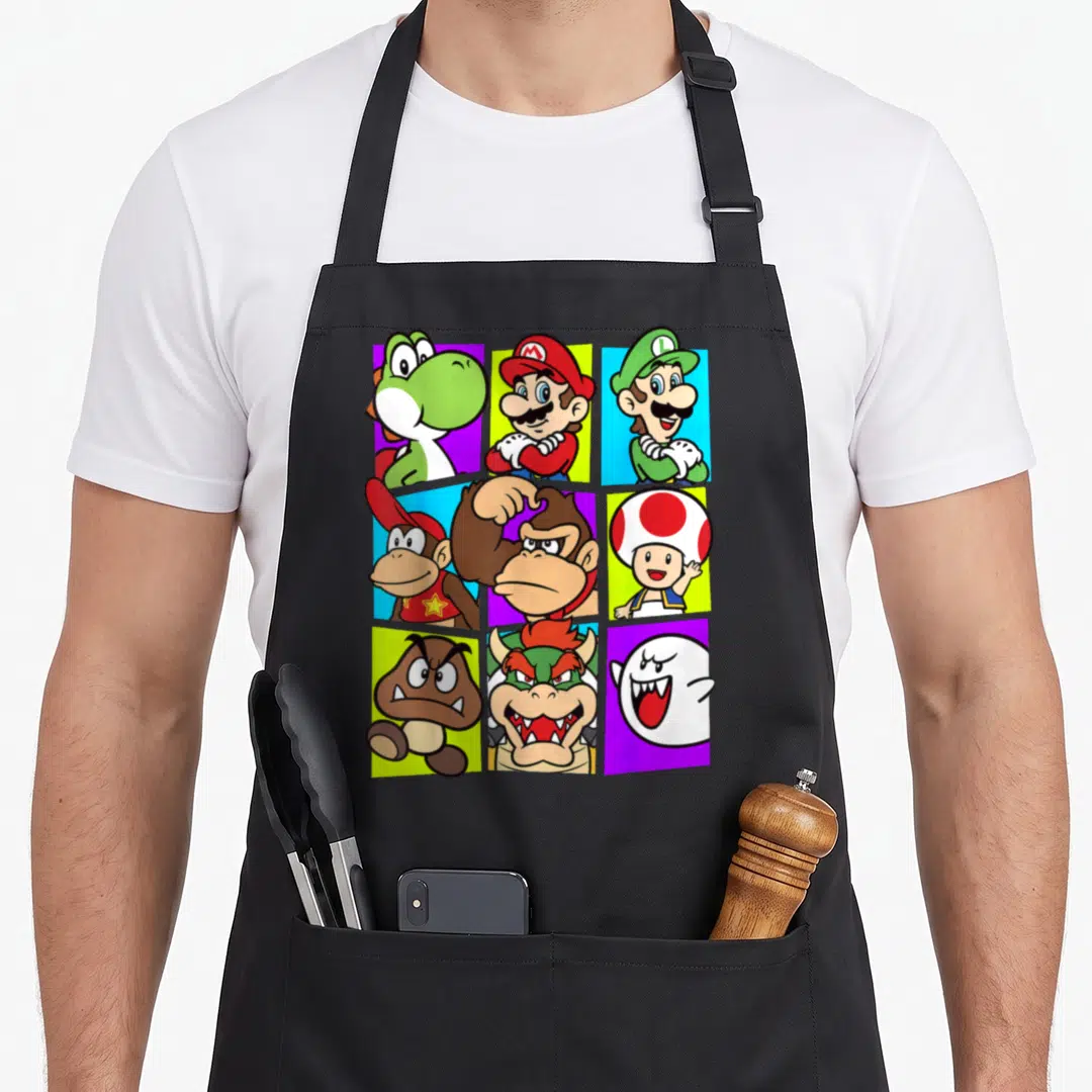 Gang box apron - Nine cartoon character portraits in a 3x3 grid on red, green, blue, purple, and yellow rectangular — shown on a black cotton canvas apron against a white background