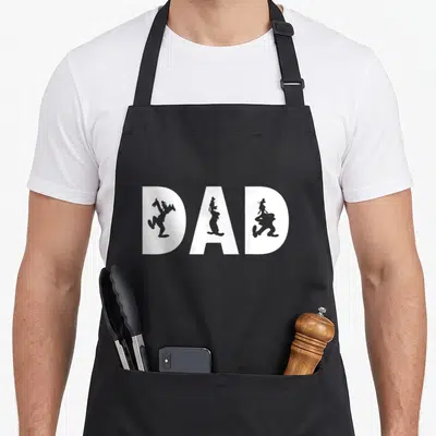 Friend fill father day apron - DAD text with grey rabbit silhouettes inside white block letters — shown on a black cotton canvas apron against a white background