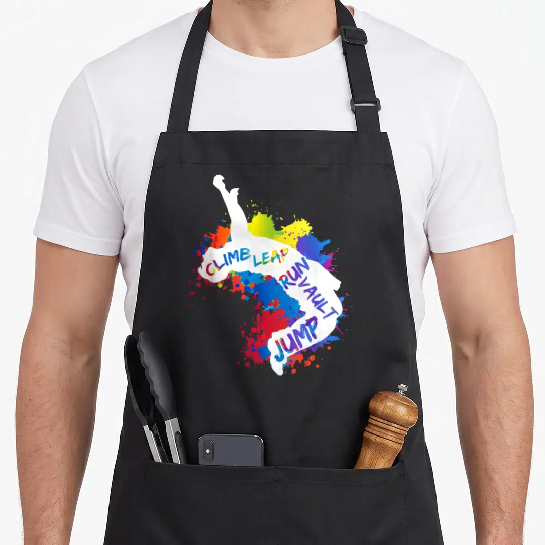 Parkour urban apron - White person silhouette with climb leap run vault jump text over multicolored paint splashes — shown on a black cotton canvas apron against a white background