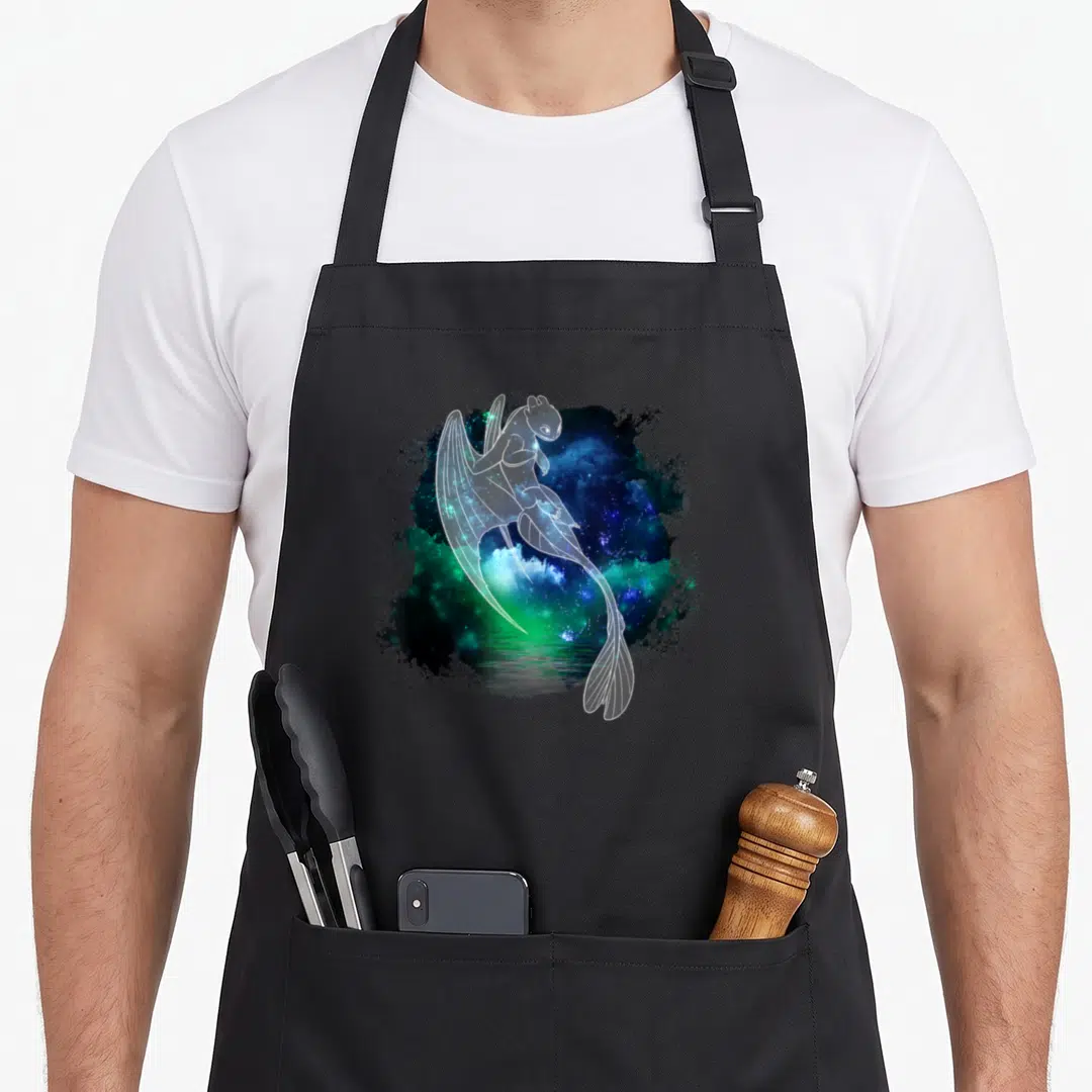 Light dragon apron - White line-art dragon over blue green purple splattered nebula reflecting in water — shown on a black cotton canvas apron against a white background