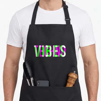Raver techno apron - VEGANS text in magenta green and white vertical stripes — shown on a black cotton canvas apron against a white background