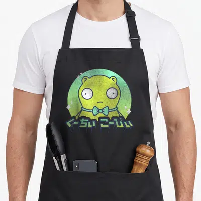 Kuchi bobs burger apron - Light green creature with bow tie and Japanese text in circle — shown on a black cotton canvas apron against a white background