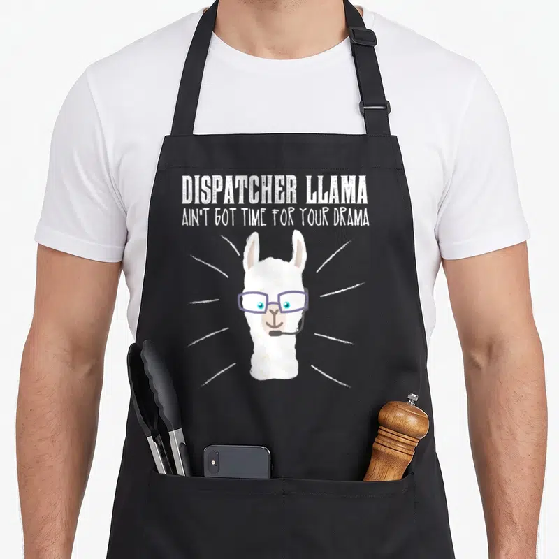 Llama future dispatcher apron - Cartoon llama with purple glasses and headset under text DISPATCHER LLAMA AIN'T GOT — shown on a black cotton canvas apron against a white background