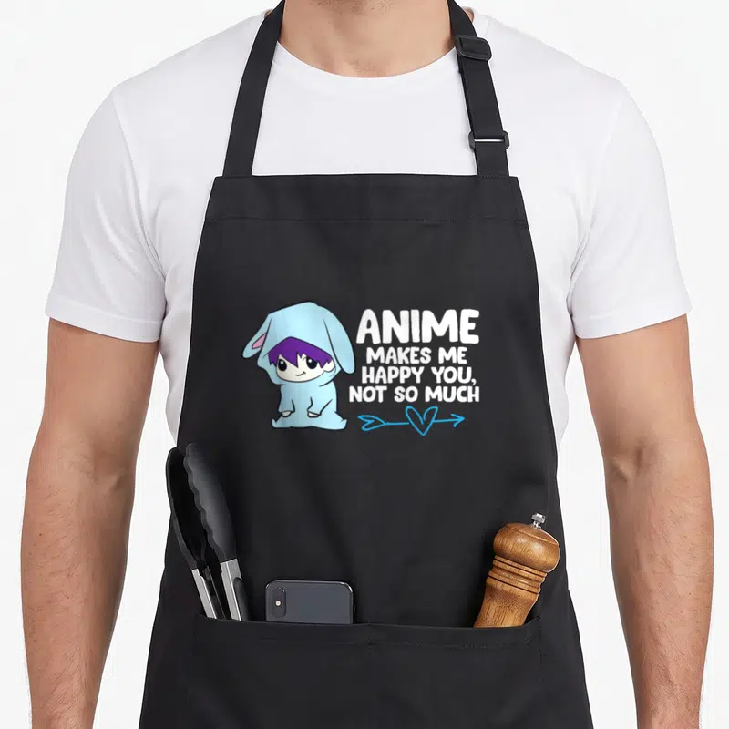 Cute much anime apron - Chibi character in blue onesie with white text ANIME MAKES ME HAPPY YOU NOT SO MUCH — shown on a black cotton canvas apron against a white background
