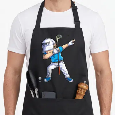 Dabbing golf apron - Cartoon golfer in blue shirt dabbing with club, Champ on hat, ball on tee — shown on a black cotton canvas apron against a white background