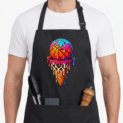 Basketball drip ice cream apron - Cartoon orange basketball melting into pink and blue frosting inside a waffle cone — shown on a black cotton canvas apron against a white background
