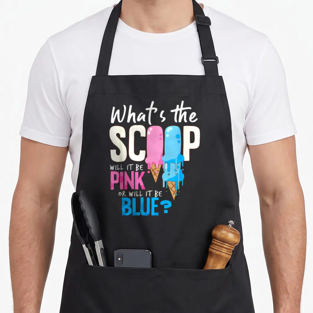 Gender ice cream apron - Stacked text with melting pink and blue ice cream cones replacing letters in scoop — shown on a black cotton canvas apron against a white background