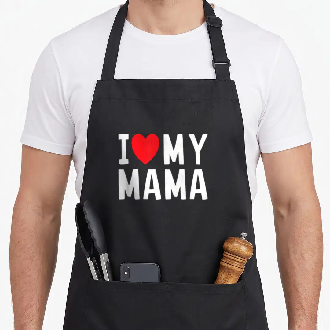 Celebrate mama apron - White I MY MAMA text with red heart graphic on grey background — shown on a black cotton canvas apron against a white background