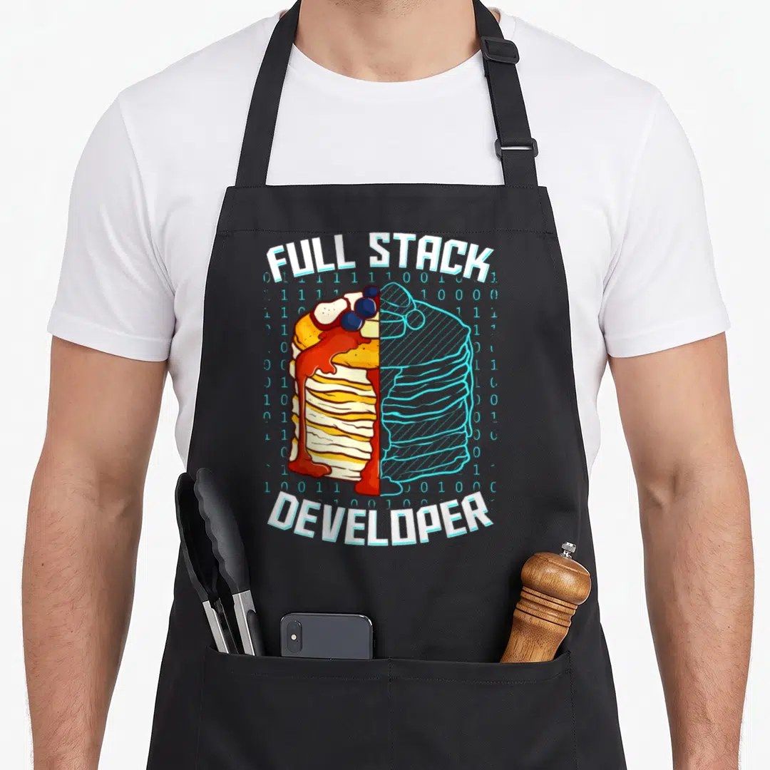 Developer pancake apron - Full stack developer text framing a split realistic and blue wireframe pancake stack — shown on a black cotton canvas apron against a white background
