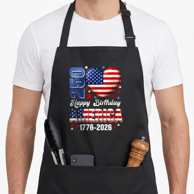 Birthday 250th 4th of july apron - Patriotic heart with American flag pattern, 250 text, and 1776-2026 dates surrounded — shown on a black cotton canvas apron against a white background