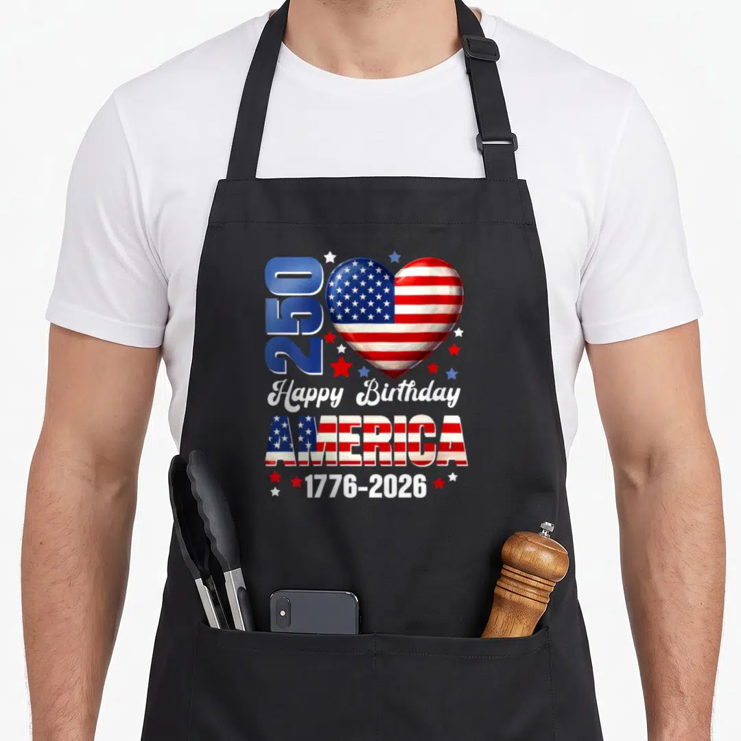 Birthday 250th 4th of july apron - Patriotic heart with American flag pattern, 250 text, and 1776-2026 dates surrounded — shown on a black cotton canvas apron against a white background