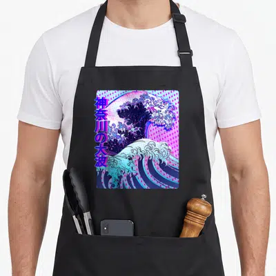 Wave vaporwave apron - Stylized Great Wave of Kanagawa in blue pink purple white with vertical Japanese text — shown on a black cotton canvas apron against a white background
