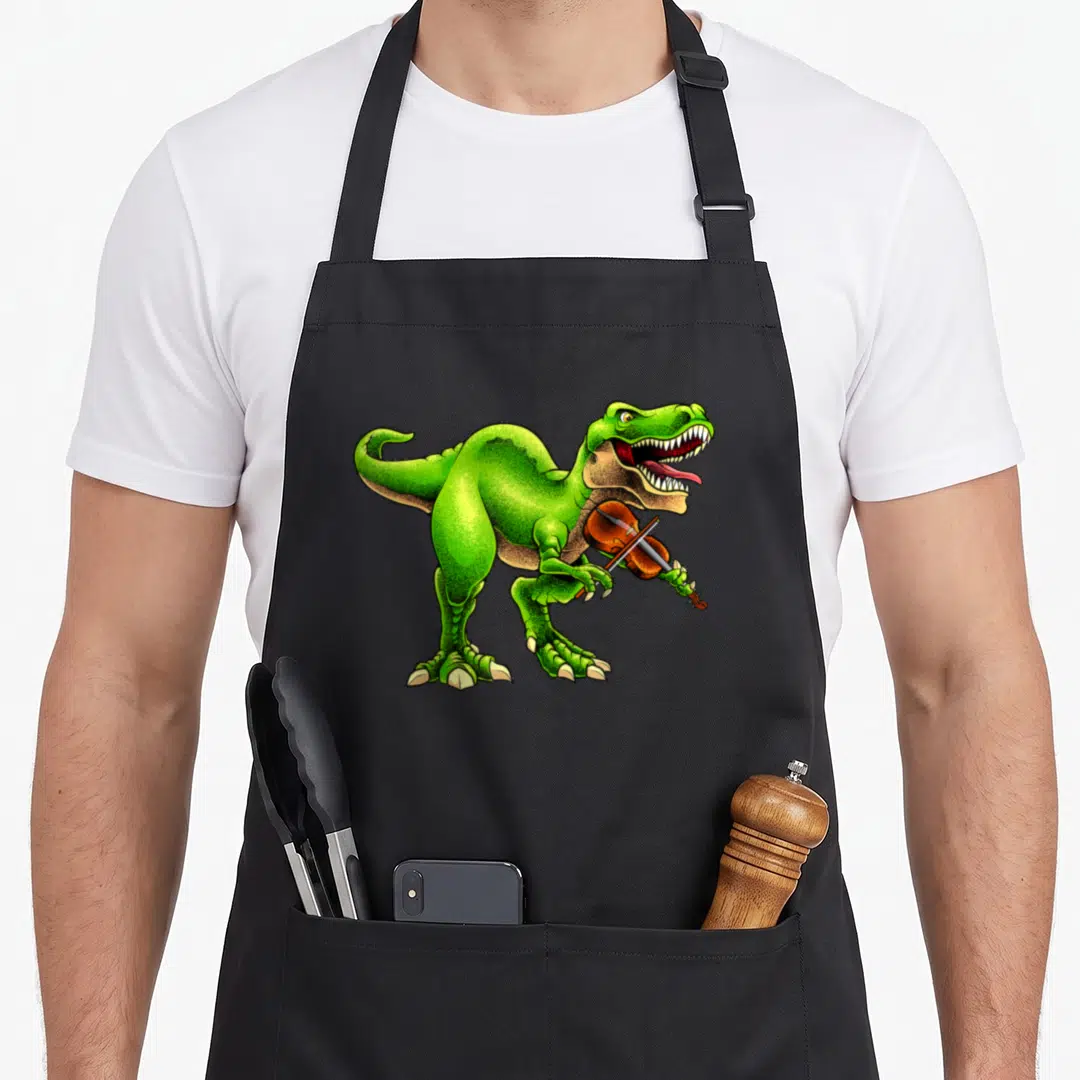 Viola violinist violin themed accessories stuff apron - Green cartoon T-Rex holding brown violin and bow in small arms — shown on a black cotton canvas apron against a white background