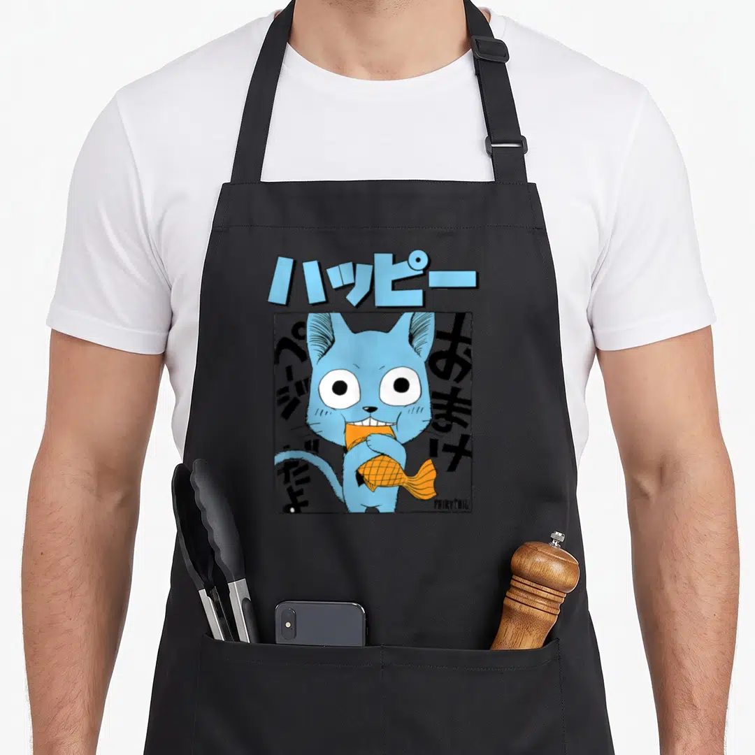 Manga eating anime apron - Blue cartoon cat holding orange fish inside square frame with Japanese text and light blue — shown on a black cotton canvas apron against a white background