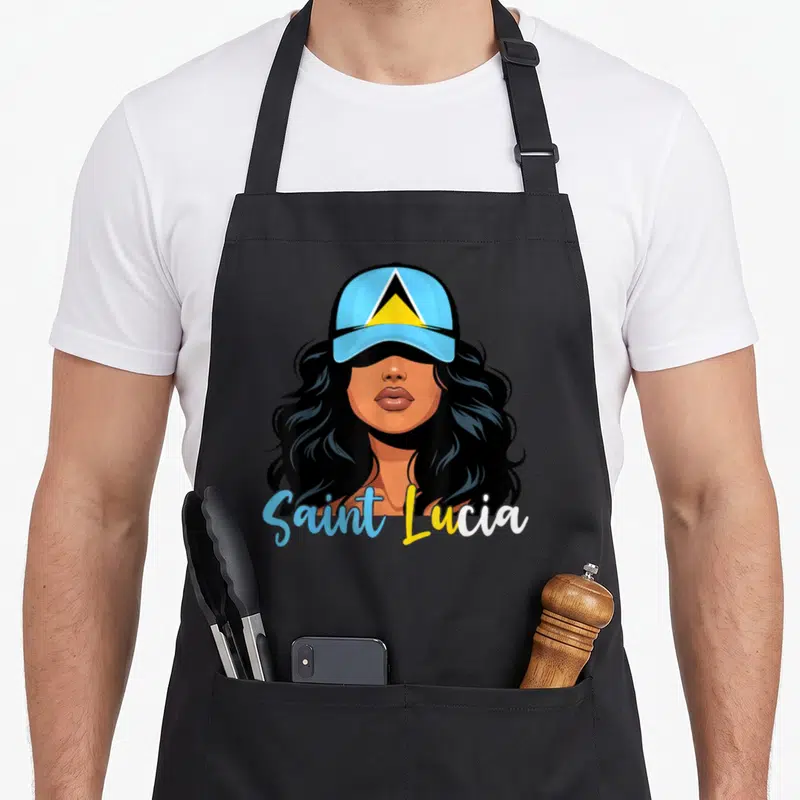 Lucian st apron - Cartoon woman in blue cap with yellow triangle, Saint Lucia text below — shown on a black cotton canvas apron against a white background
