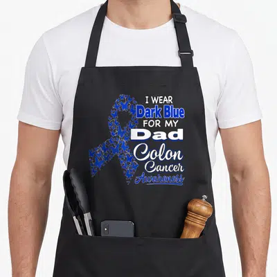 Dark colon cancer awareness apron - Butterfly awareness ribbon with I Wear Dark Blue For My Dad Colon Cancer Awareness — shown on a black cotton canvas apron against a white background