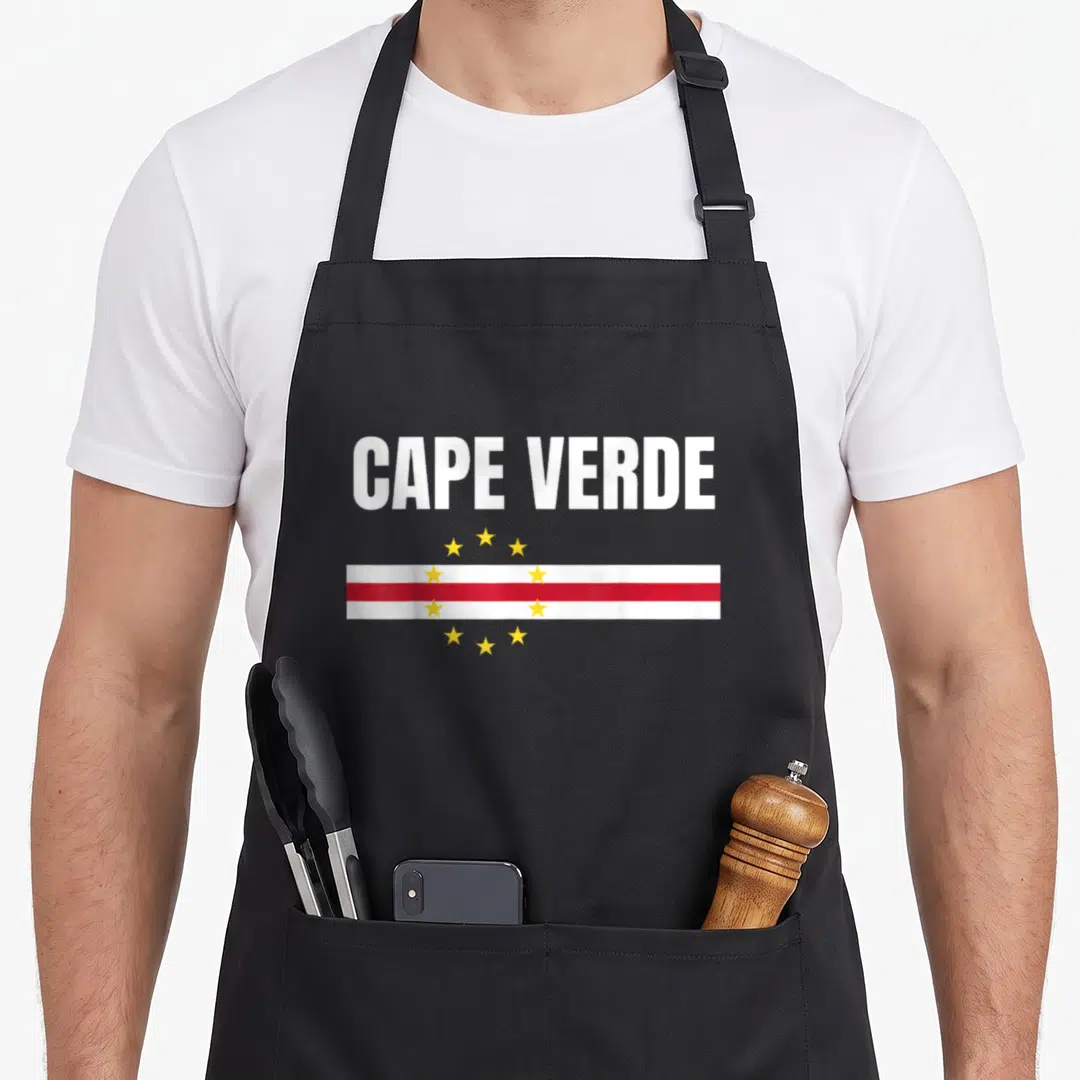 Flag cape verde apron - CAPE VERDE text above red and yellow flag with ten stars on black bib — shown on a black cotton canvas apron against a white background