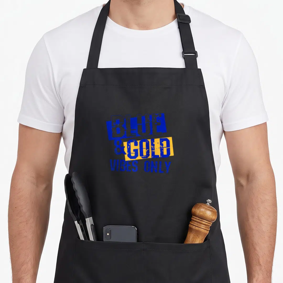 Game school football apron - Stacked blue and yellow rectangles with distressed text reading blue and gold vibes only — shown on a black cotton canvas apron against a white background