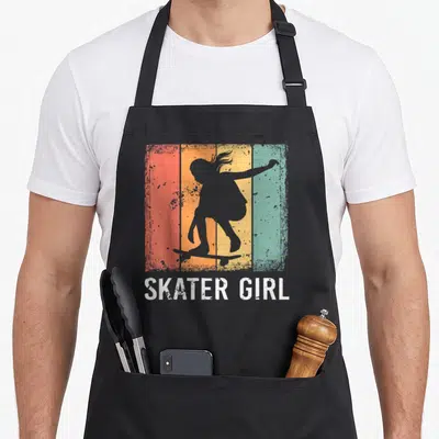 Skating best skater skateboarder accessories stuff apron - Grey girl silhouette on skateboard over vertical red orange — shown on a black cotton canvas apron against a white background