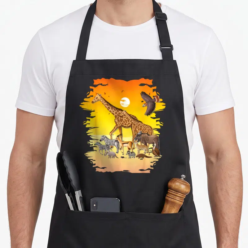 Jungle african apron - Realistic giraffes zebras and birds against orange yellow sunset with white sun — shown on a black cotton canvas apron against a white background