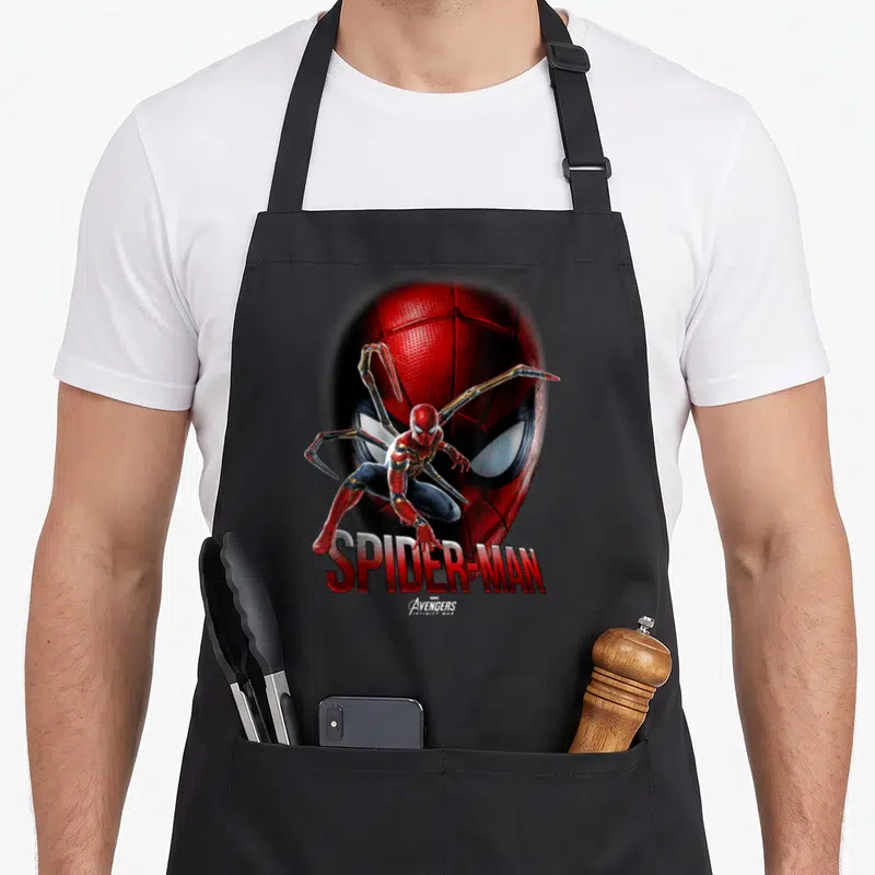 Infinity face apron - Realistic Spider-Man in red and blue suit with gold mechanical arms and SPIDER-MAN text below — shown on a black cotton canvas apron against a white background
