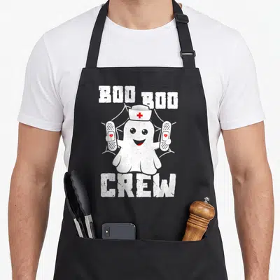 Crew halloween nurse apron - Ghost nurse holding bandages with BOO BOO CREW text on spider web background — shown on a black cotton canvas apron against a white background