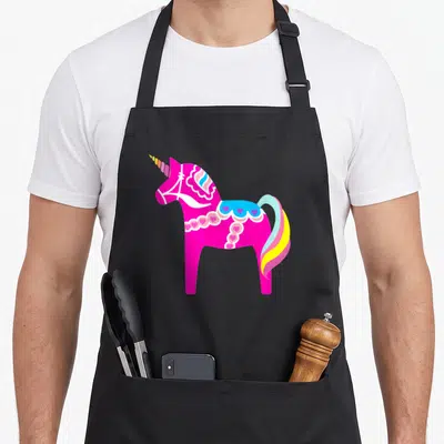Unicorn swedish apron - Pink unicorn with rainbow horn and blue hearts in cartoon style — shown on a black cotton canvas apron against a white background