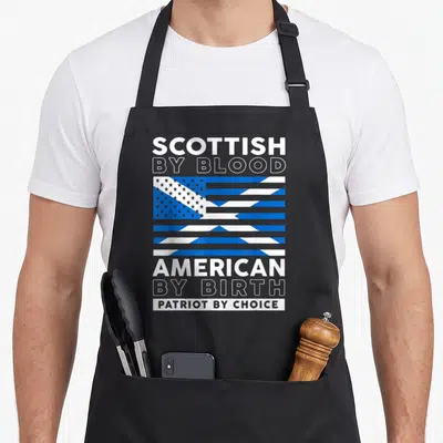 Choice blood apron - SCOTTISH BY BLOOD AMERICAN BY BIRTH PATRIOT BY CHOICE text with blue white flag graphic — shown on a black cotton canvas apron against a white background