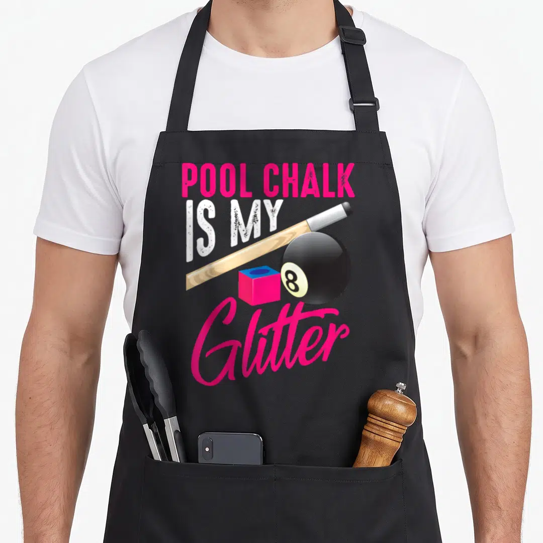 Chalk game aprons - Pool Chalk is My Glitter text with cue, 8-ball, and pink chalk cube — shown on a black cotton canvas apron against a white background