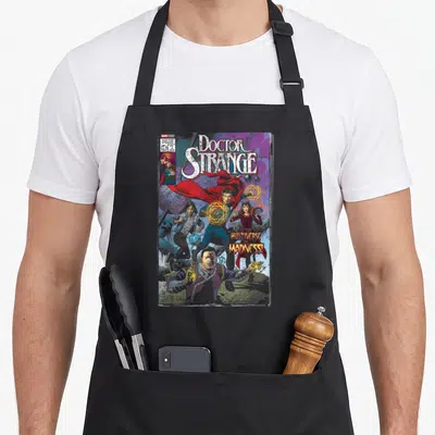 Multiverse doctor apron - Doctor Strange comic cover with four characters and yellow subtitle text — shown on a black cotton canvas apron against a white background