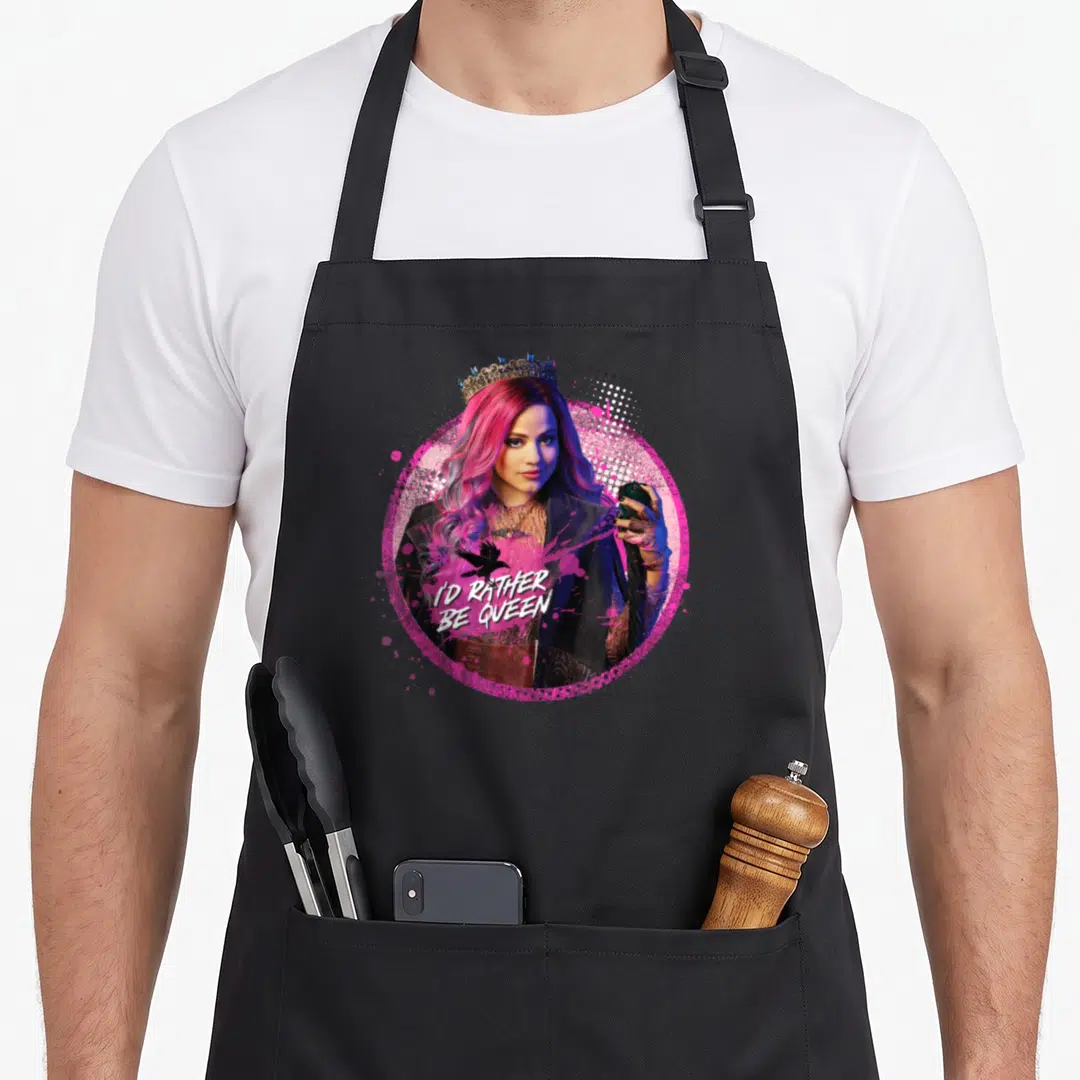 Descendant queen apron - Woman with pink hair and crown inside pink circle with text I'D RATHER BE QUEEN and raven — shown on a black cotton canvas apron against a white background