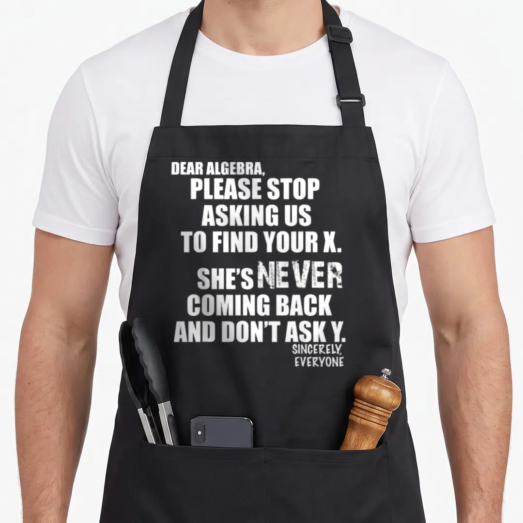Dear algebra us aprons - White stacked text reading Dear Algebra please stop asking us to find your X on black — shown on a black cotton canvas apron against a white background