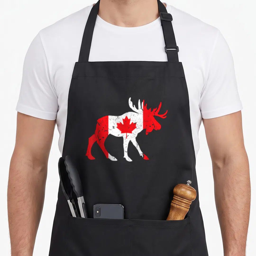 Maple animal apron - Distressed red and white moose silhouette containing a central maple leaf — shown on a black cotton canvas apron against a white background