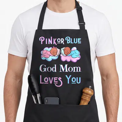 Blue god apron or apron - PINK OR BLUE text with two sleeping cartoon babies in pink and blue clouds — shown on a black cotton canvas apron against a white background