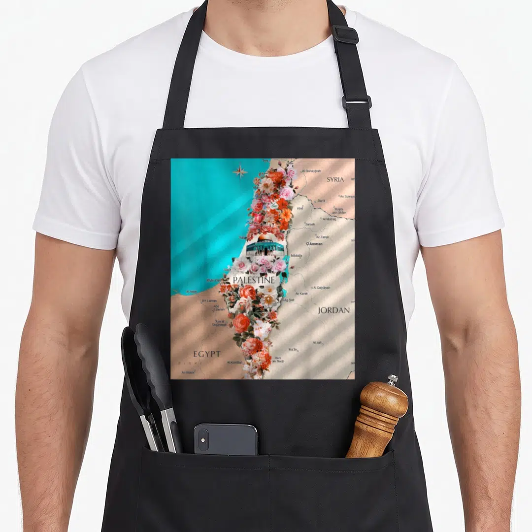 Map palestinian apron - Floral map of Palestine with Dome of the Rock and labels for Syria, Jordan, Egypt, and Sinai — shown on a black cotton canvas apron against a white background