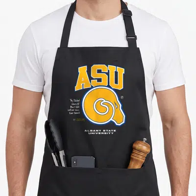 Asu golden apron - Yellow ASU logo and ram head with blue outline and script text on black fabric — shown on a black cotton canvas apron against a white background