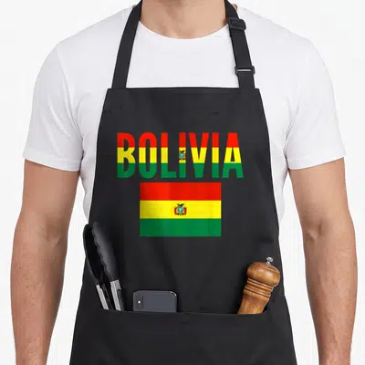 Bolivia flag country apron - The word BOLIVIA filled with red yellow and green stripes above a rectangular flag — shown on a black cotton canvas apron against a white background