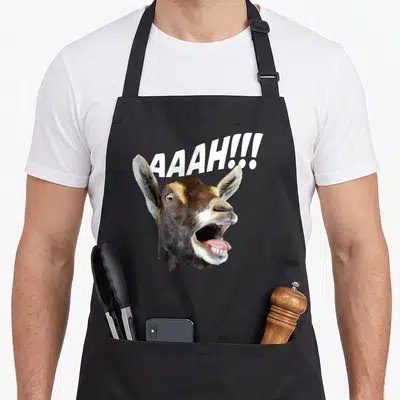 Aaah halloween apron - Realistic screaming goat head with white AAAH text above — shown on a black cotton canvas apron against a white background