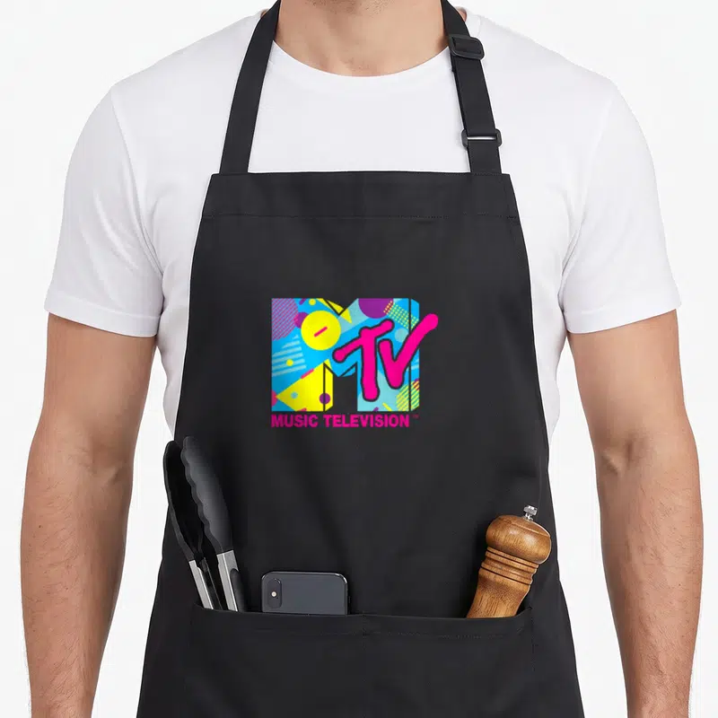 Funny mtv spring aprons - Retro MTV logo with colorful geometric M and pink MUSIC TELEVISION text — shown on a black cotton canvas apron against a white background