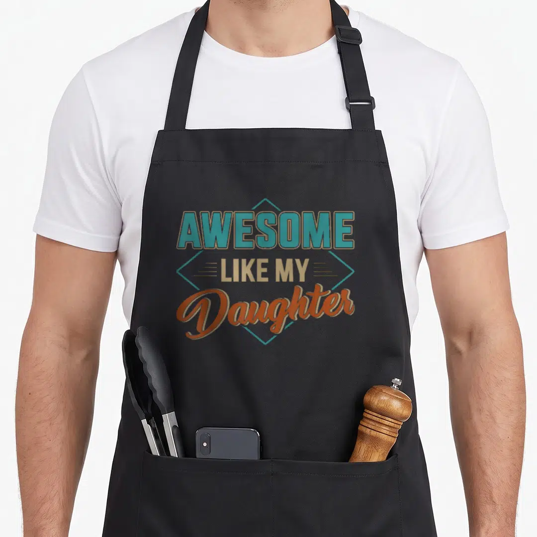 Cute daughter father day apron - Stacked AWESOME LIKE MY Daughter text in teal tan orange inside diamond frame — shown on a black cotton canvas apron against a white background