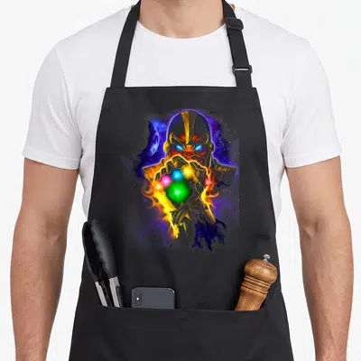 Powerful infinity apron - Realistic Thanos holding golden gauntlet with colorful gems against purple cosmic background — shown on a black cotton canvas apron against a white background